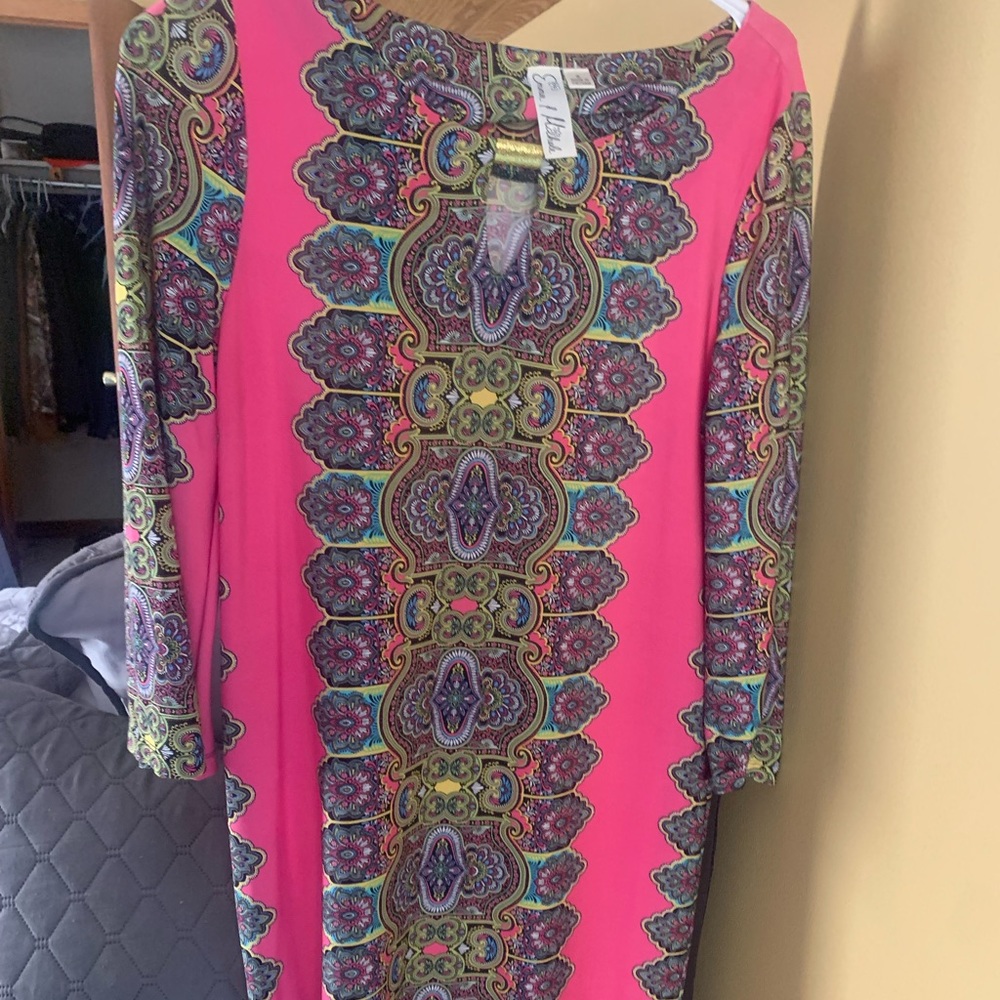 Gorgeous dress. Multi colored. About to knee length maybe longer. No stains